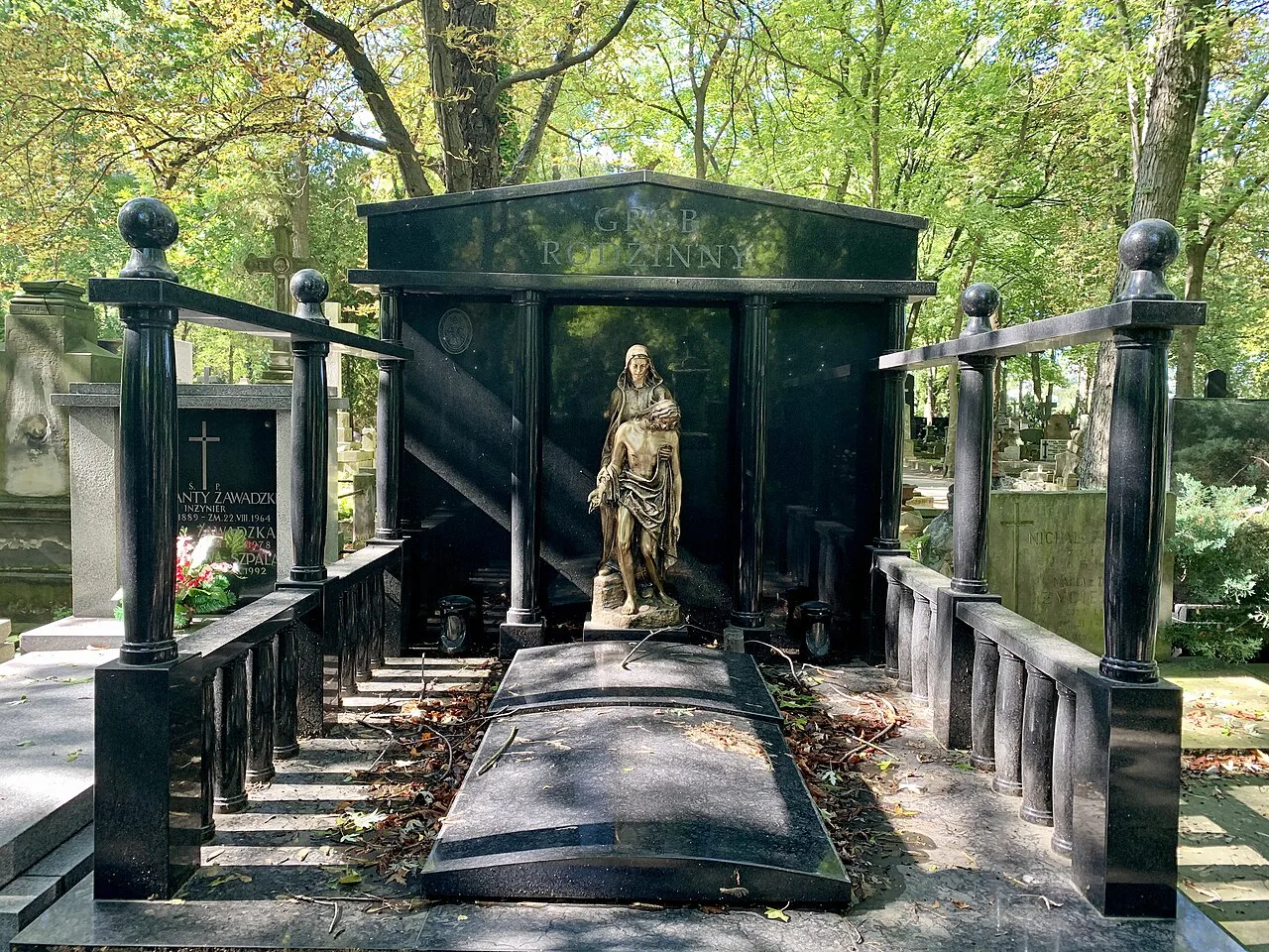 A sculpted grave monument at Powązki Cemetery in Warsaw.