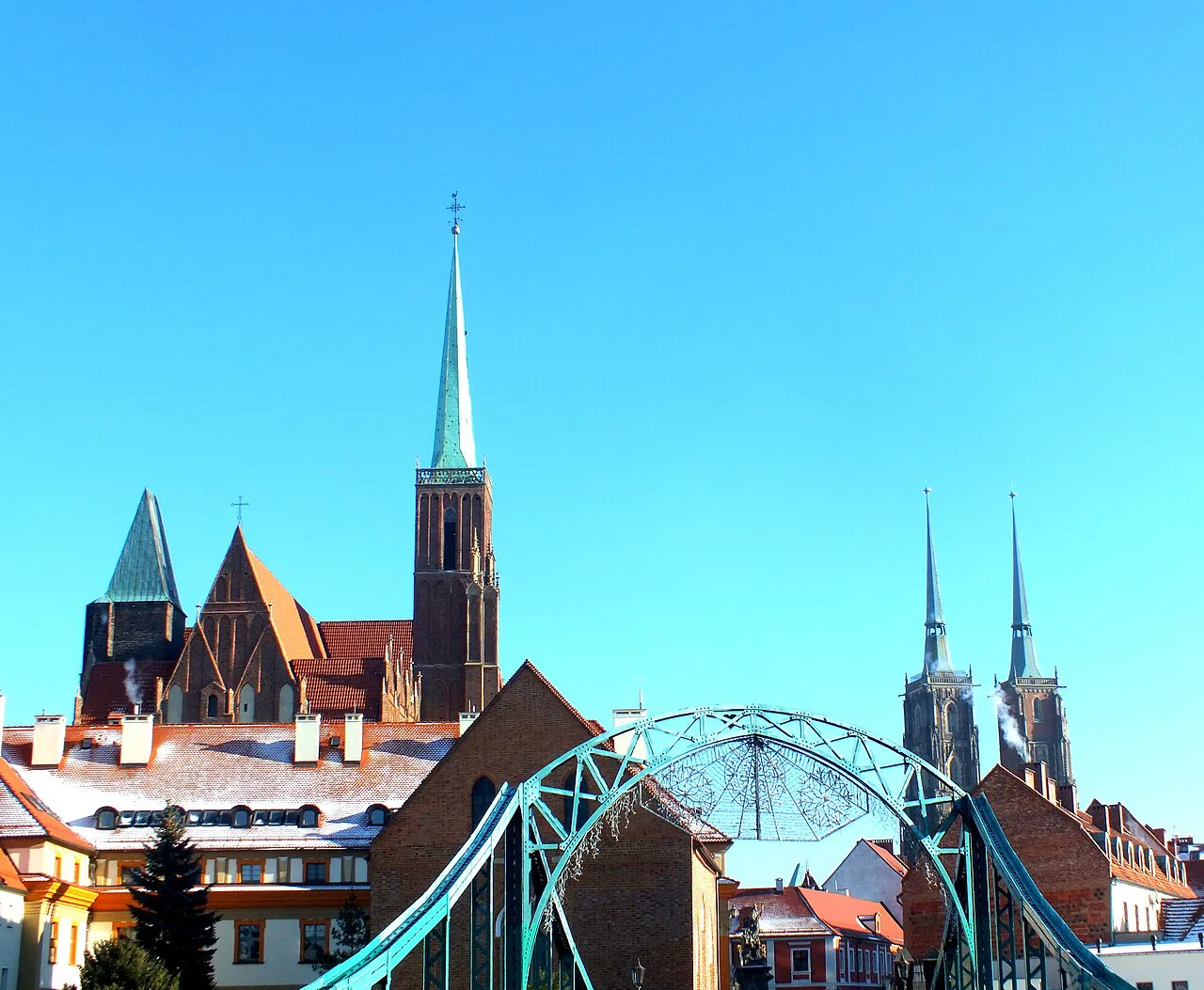 The cathedral towers of Ostrów Tumski above Tumski Bridge in Wrocław.