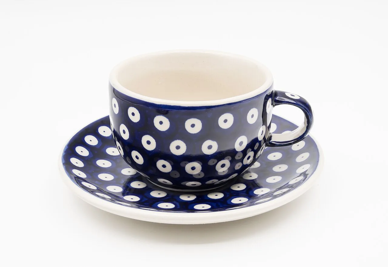 A Bolesławiec pottery cup and saucer.