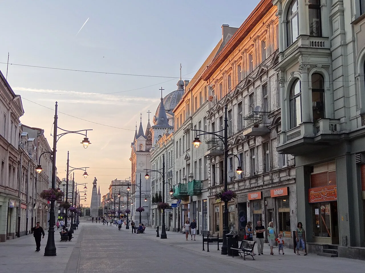 Piotrkowska Street in Łódź at dusk.