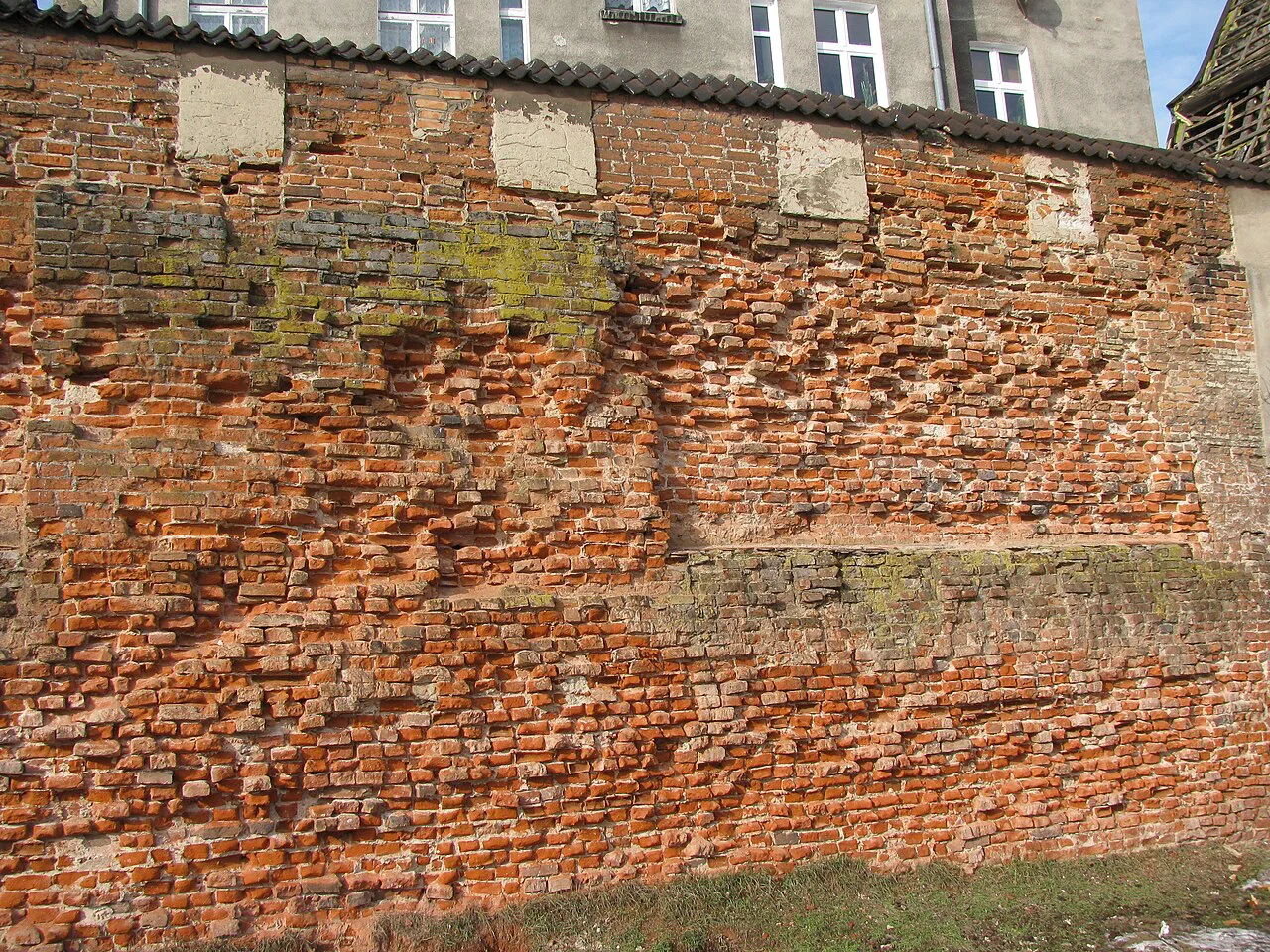 A stretch of the medieval brick walls of Gdańsk Castle.