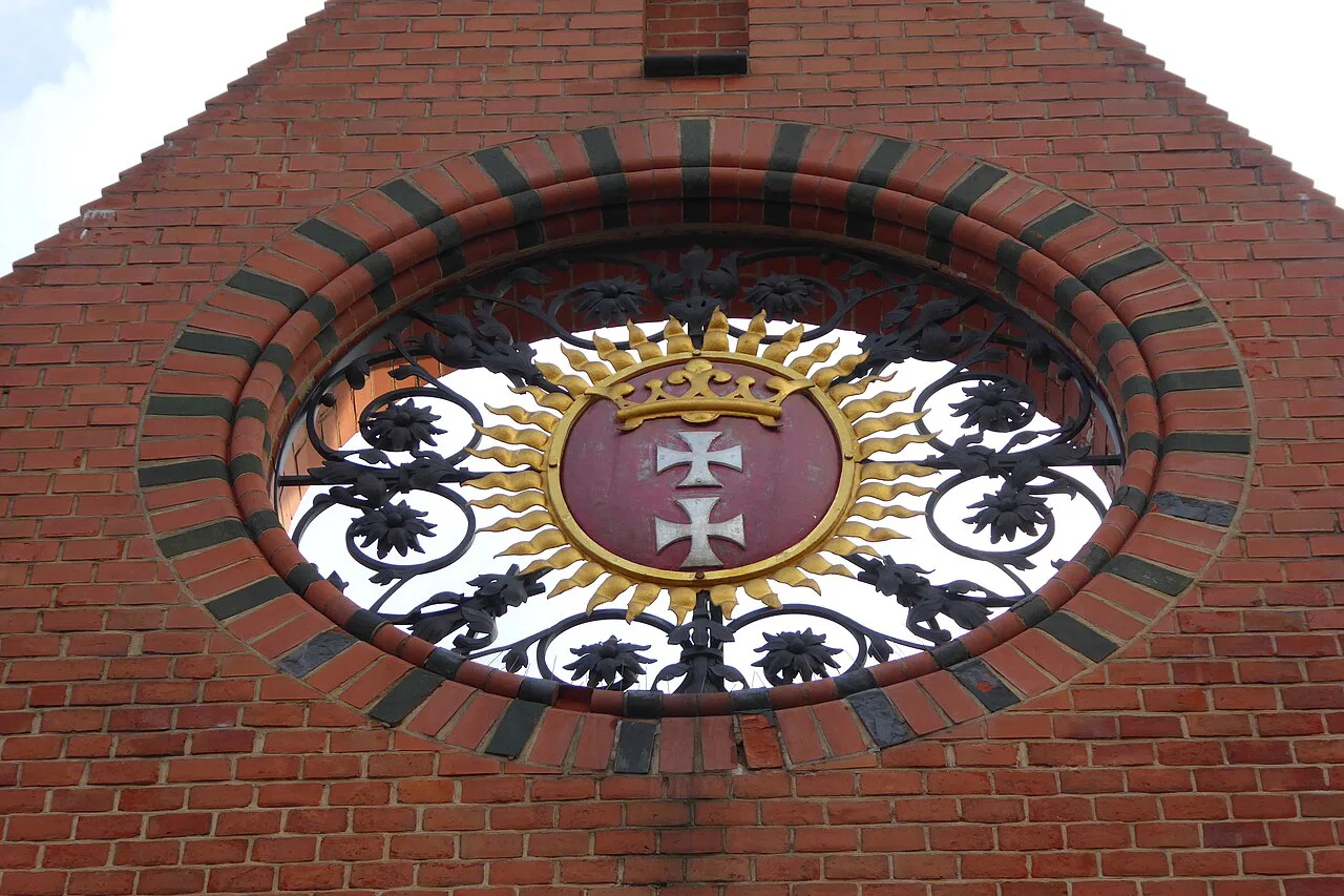 Gdańsk coat of arms on the exterior of the Market Hall.