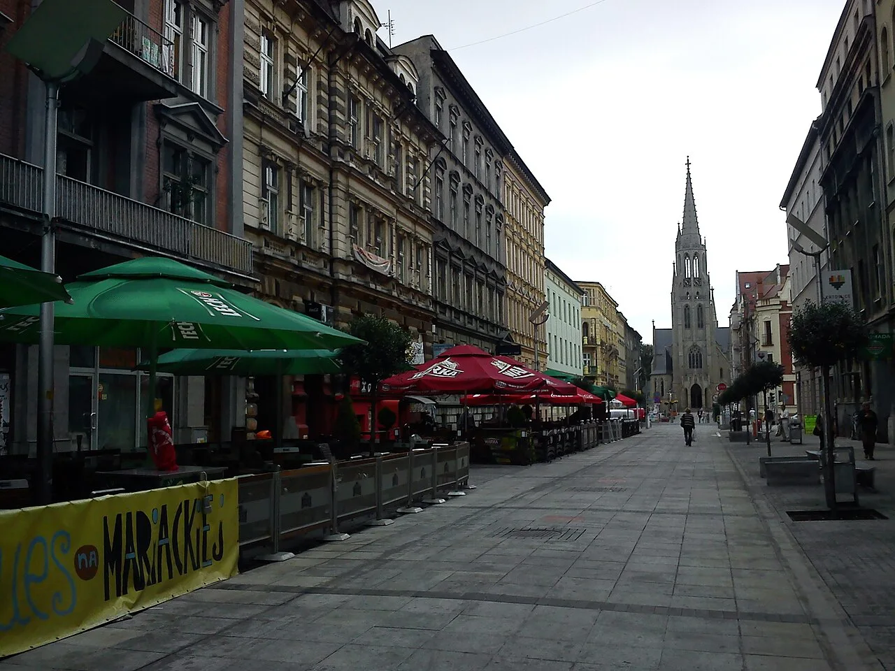 Café terraces on Mariacka Street in Katowice, with St Mary's Church at the far end.