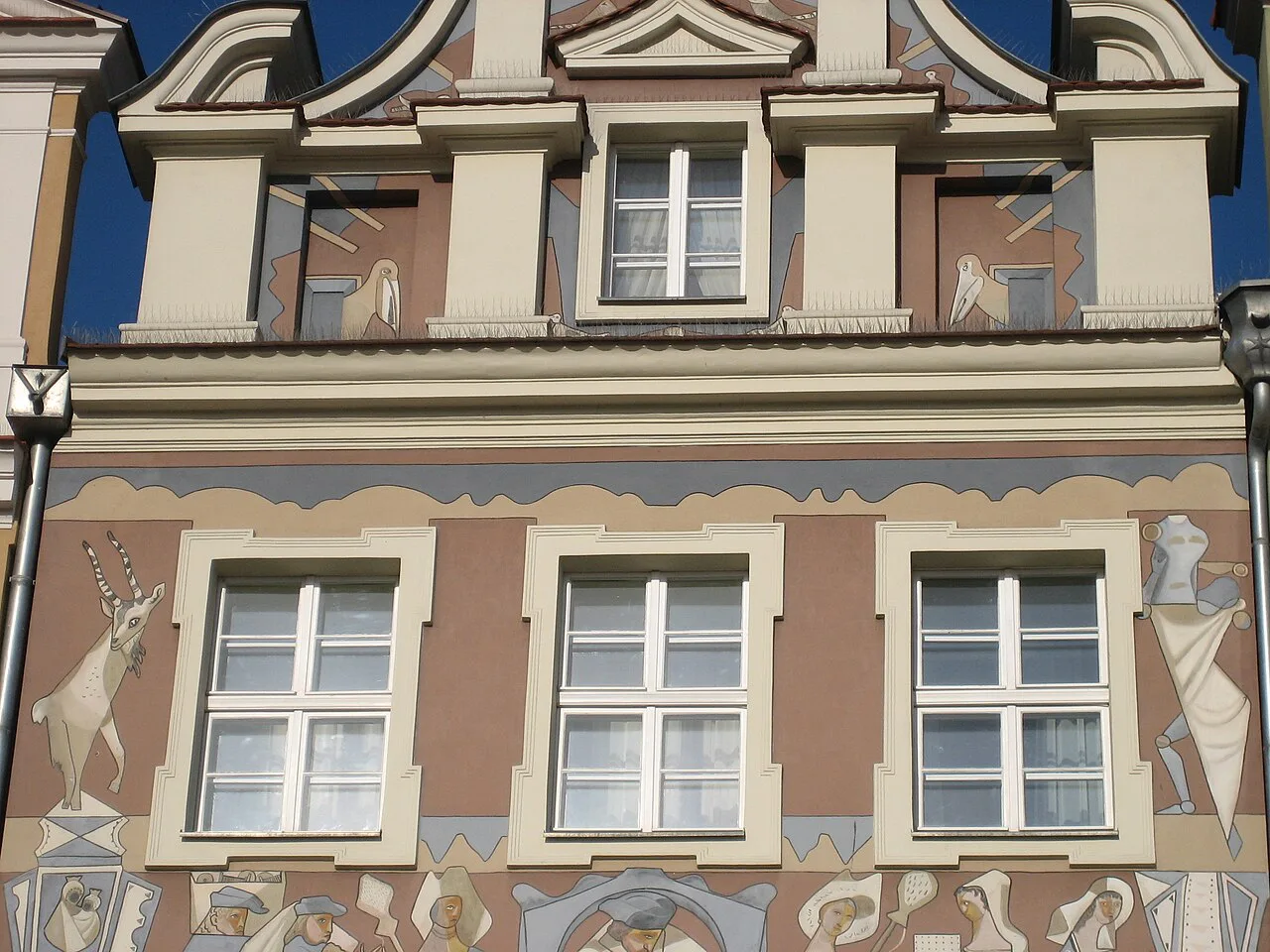 A decorated house façade on the Old Market Square in Poznań.
