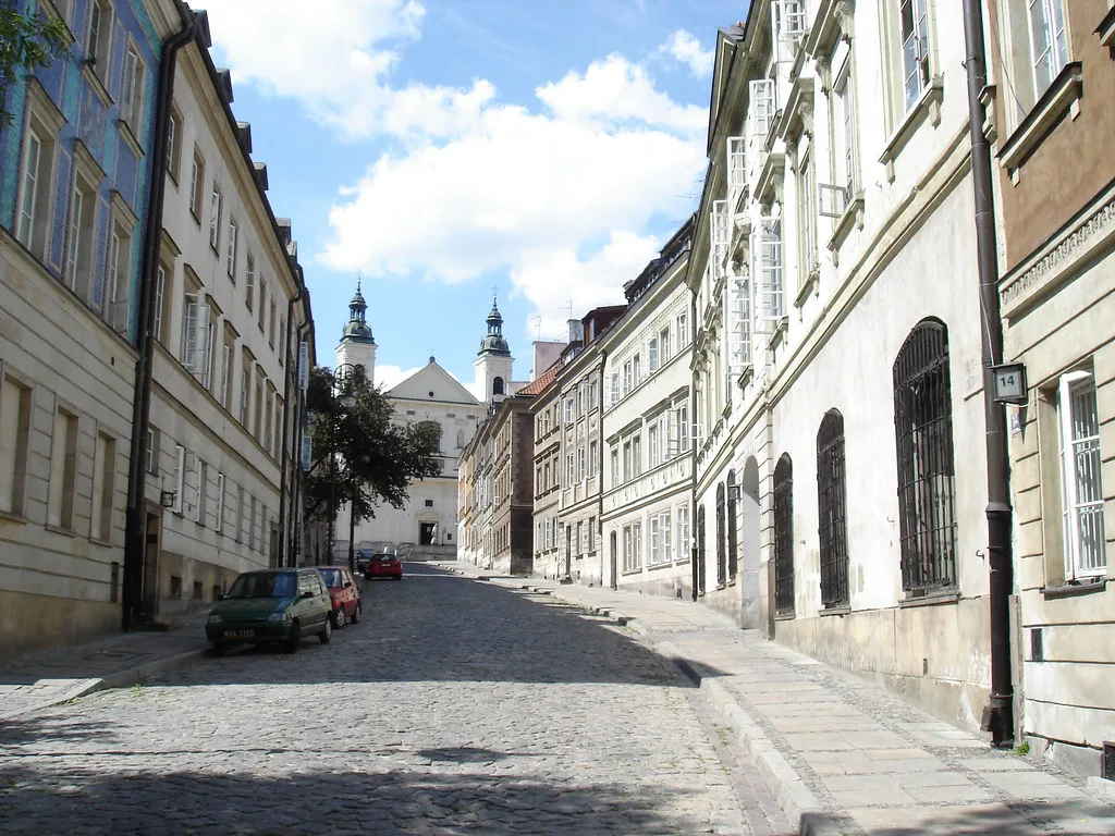 A cobbled street of townhouses in Warsaw.