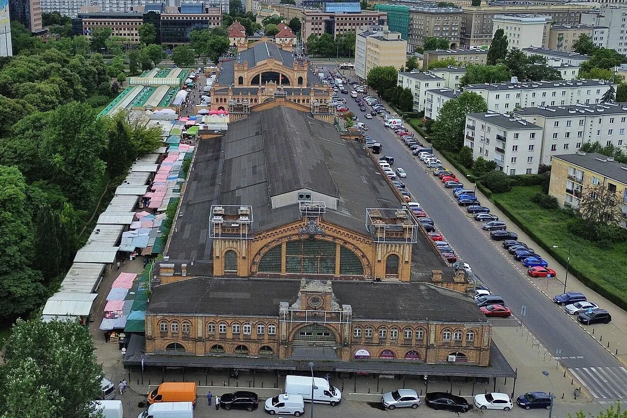Hale Mirowskie market halls in Warsaw from above, with outdoor stalls alongside