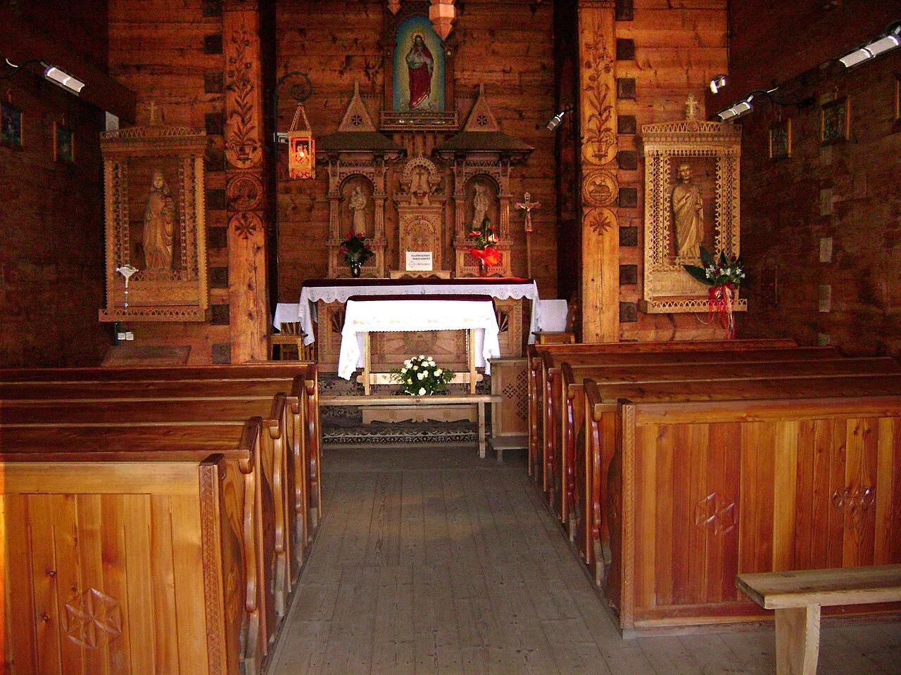 The wooden interior of the chapel at Jaszczurówka in Zakopane.