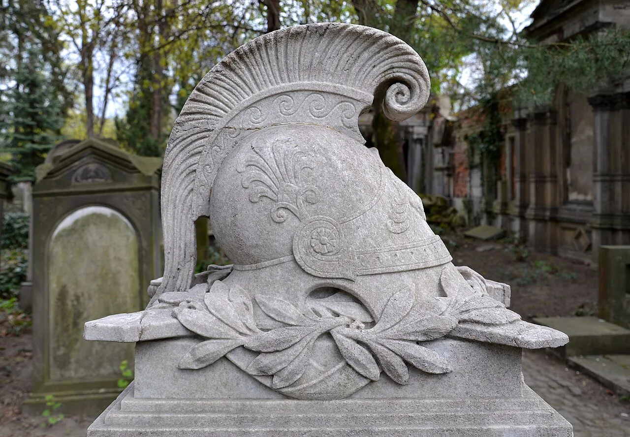 A sculpted helmet monument in the Old Jewish Cemetery in Wrocław.