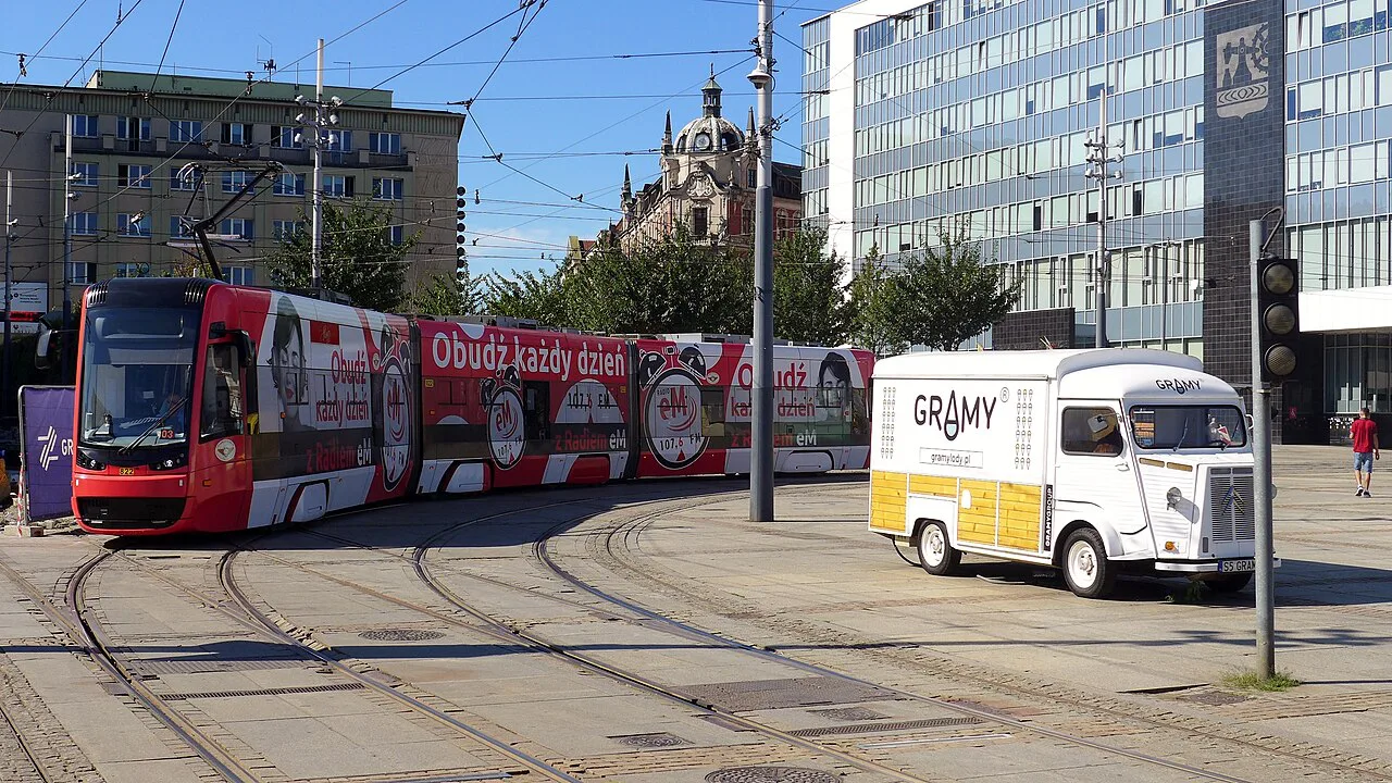A tram rounding a curve in the Market Square in Katowice.