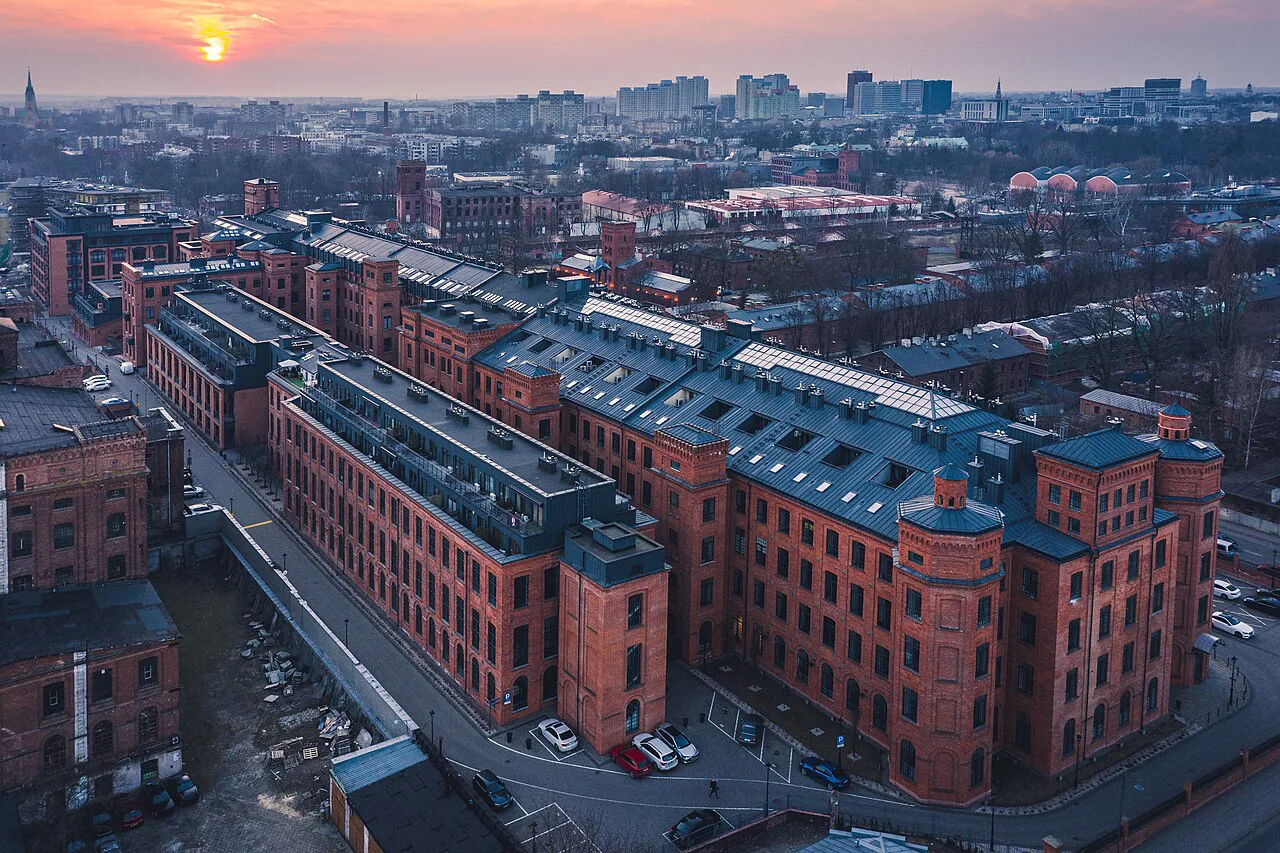 Aerial view of Księży Młyn in Łódź at sunset.