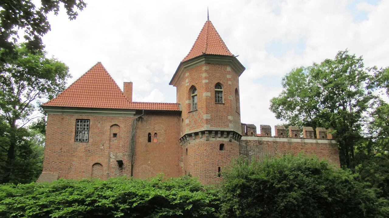 Oporów Castle seen across its gardens in Łódź Voivodeship.
