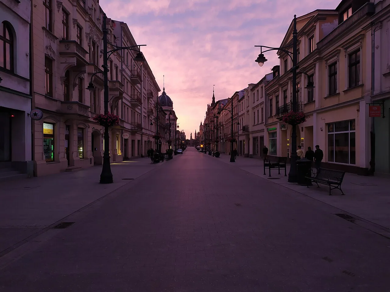 Piotrkowska Street in Łódź at sunset.