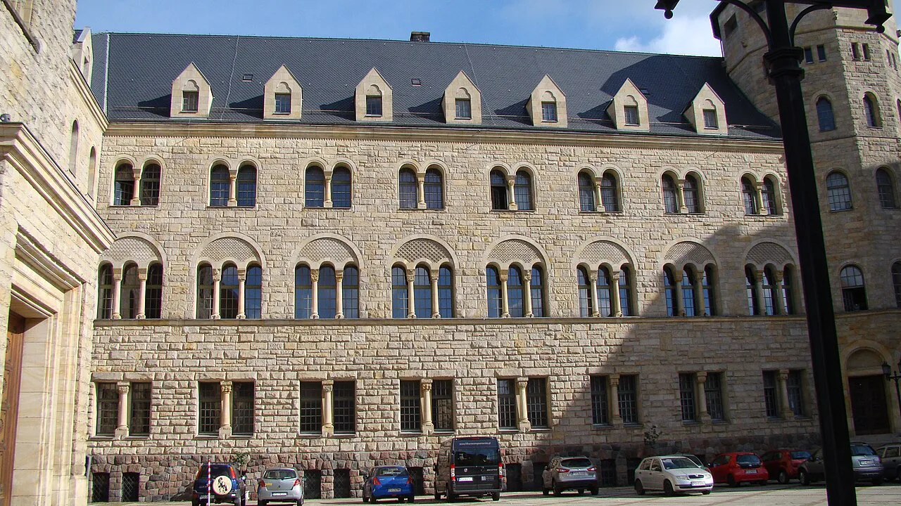 The stone façade of the Imperial Castle in Poznań.