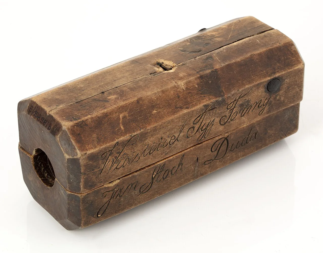 A carved wooden oscypek mould in the Tatra Museum collection.