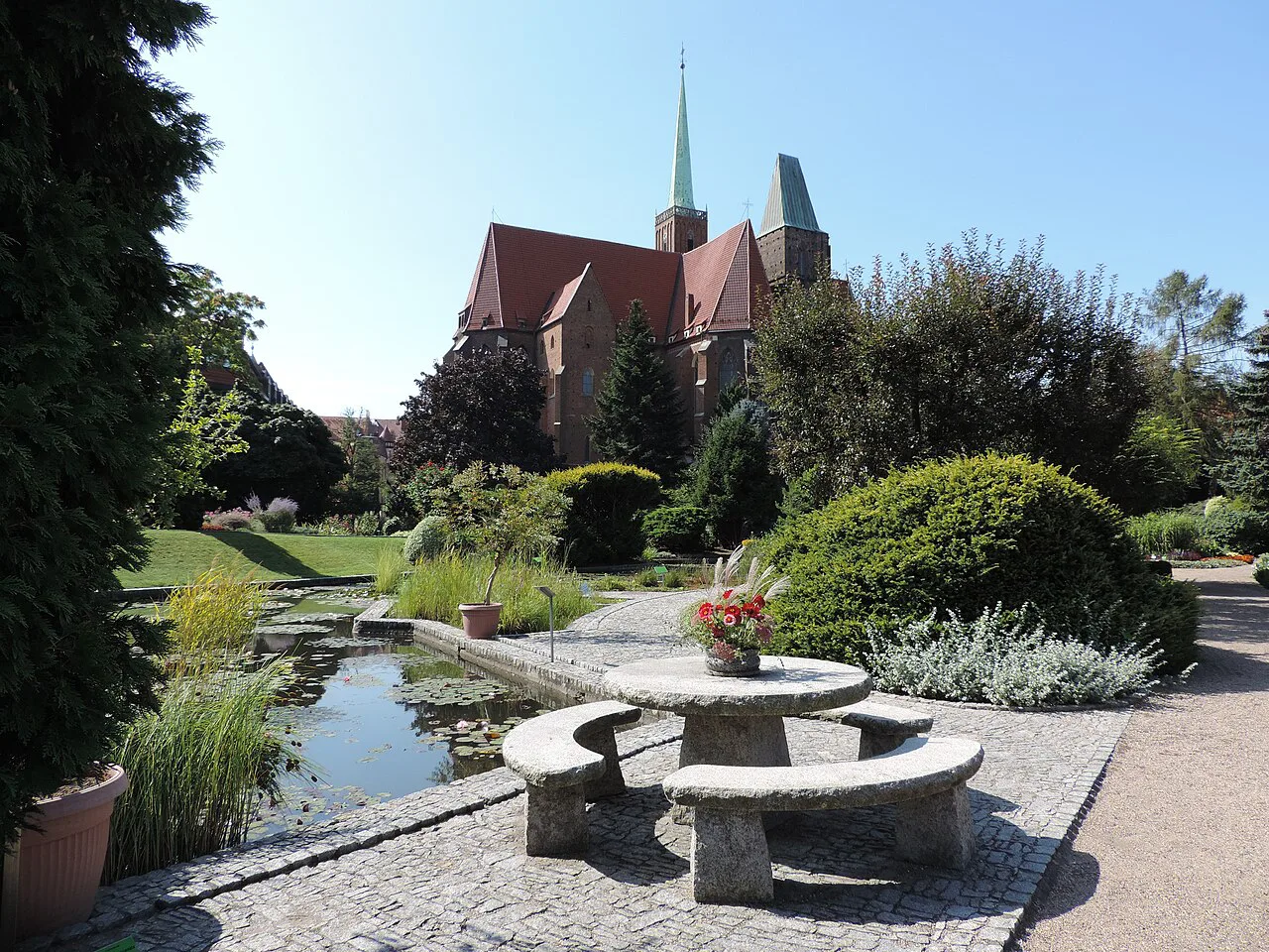 Wrocław Botanical Garden with a church spire on Ostrów Tumski behind.