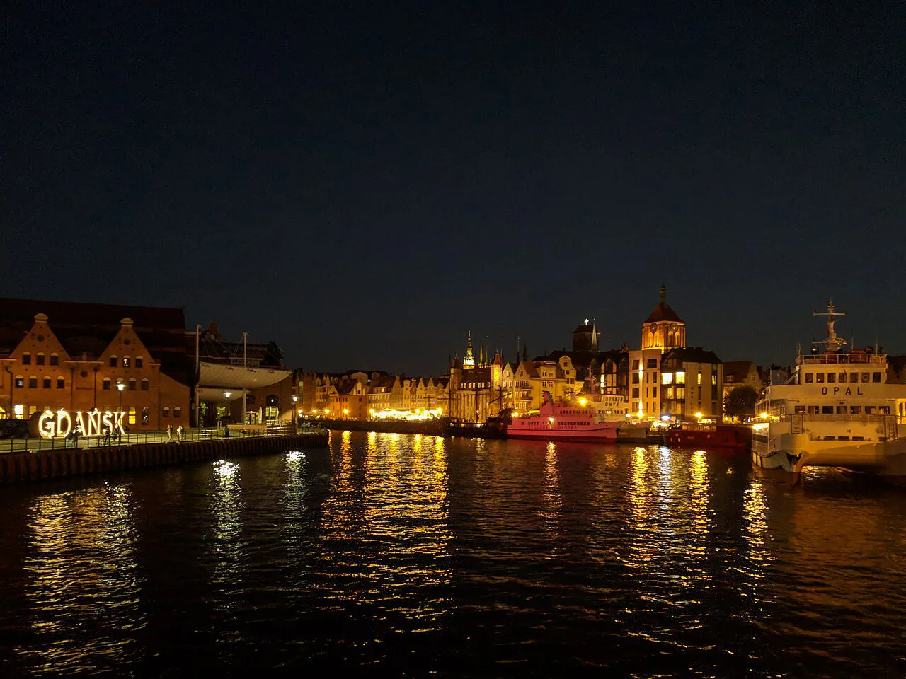 The Motława waterfront in Gdańsk at night.
