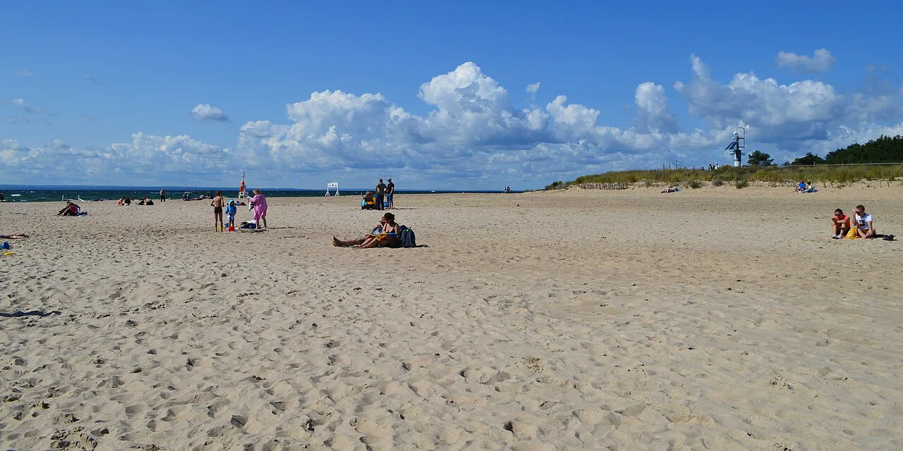 A sandy beach on the Hel Peninsula in summer.