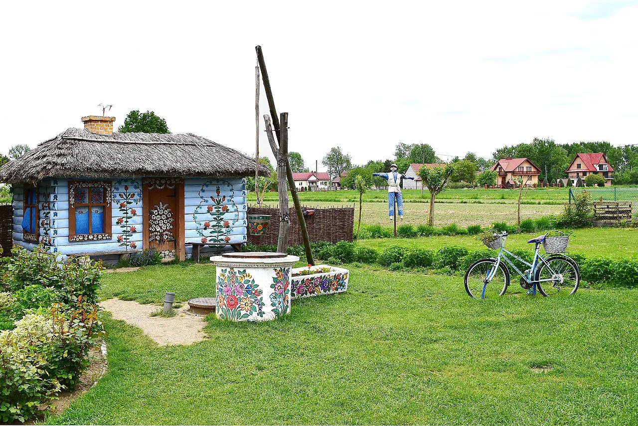 A floral-painted cottage and garden in Zalipie.