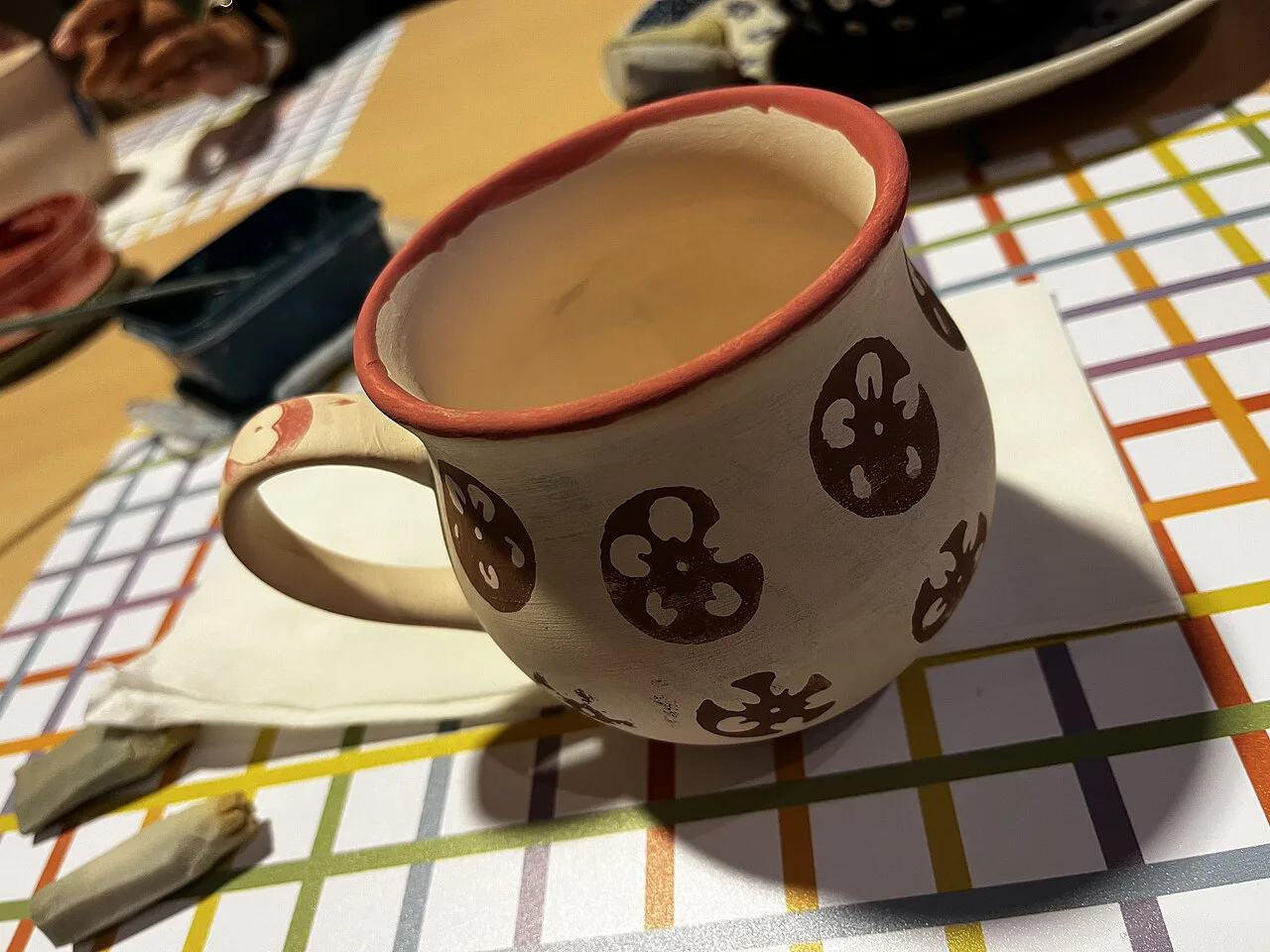 A hand-painted Bolesławiec pottery mug.