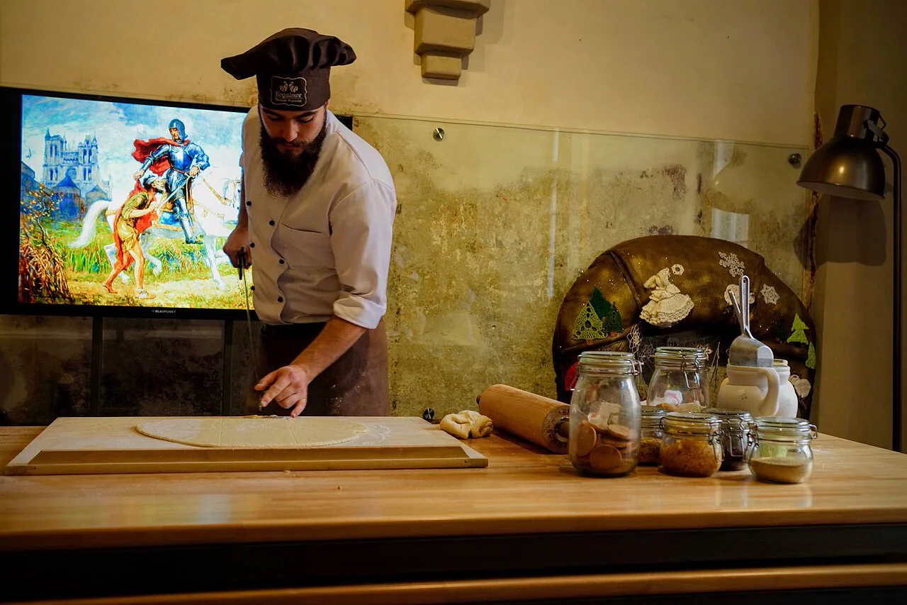 A baker preparing St Martin's croissant dough in Poznań.
