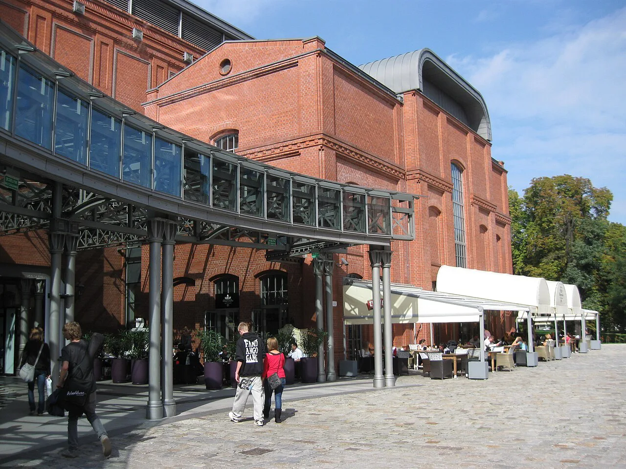 Café tables outside Stary Browar in Poznań.