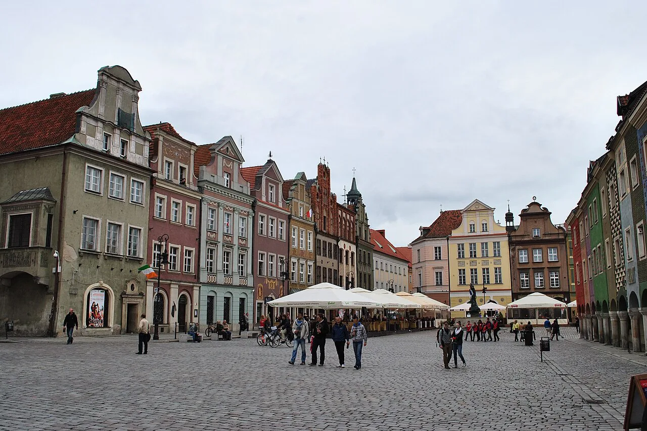 Townhouses and café terraces on Poznań's Old Market Square.