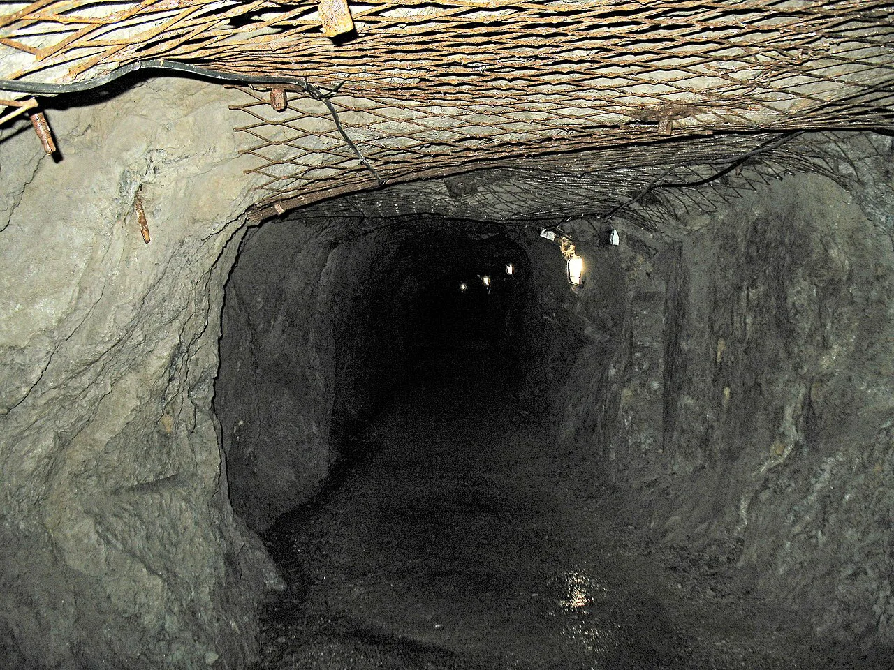 A rock-hewn tunnel in the Osówka underground complex.