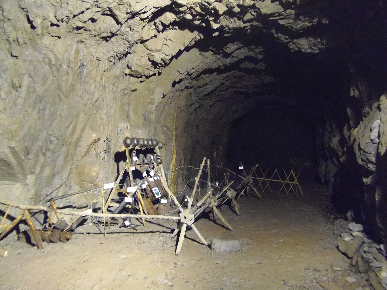 A display of wartime objects in a tunnel at Osówka.