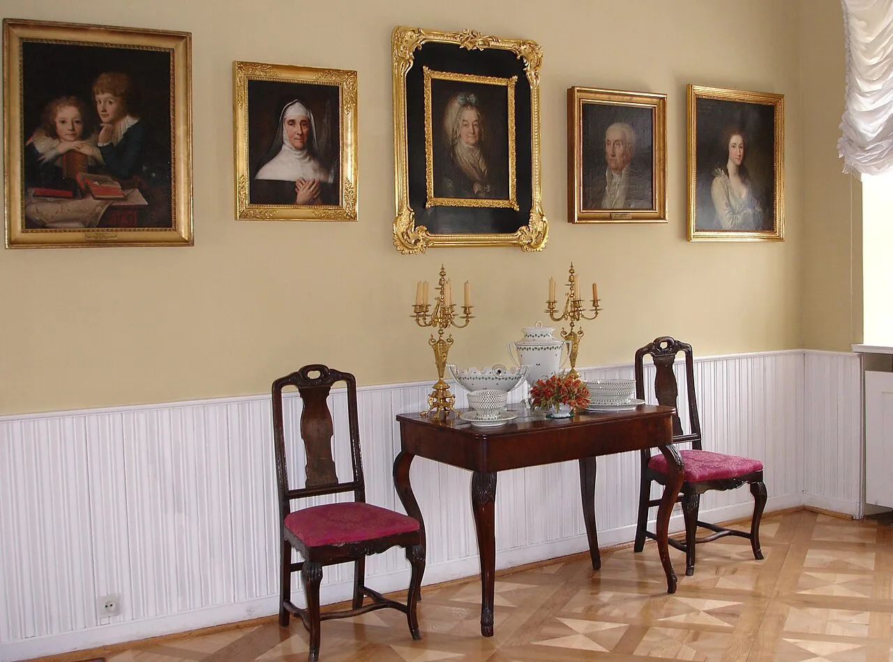 Portrait-hung room inside Rogalin Palace.