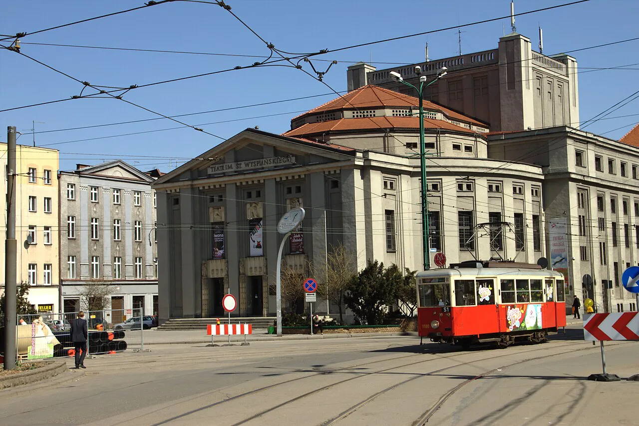 A historic tram on Katowice's Market Square, with the Silesian Theatre behind.