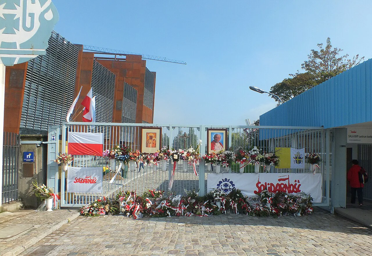 Flowers at the historic Gate No. 2 of the Gdańsk Shipyard on Solidarity Square.