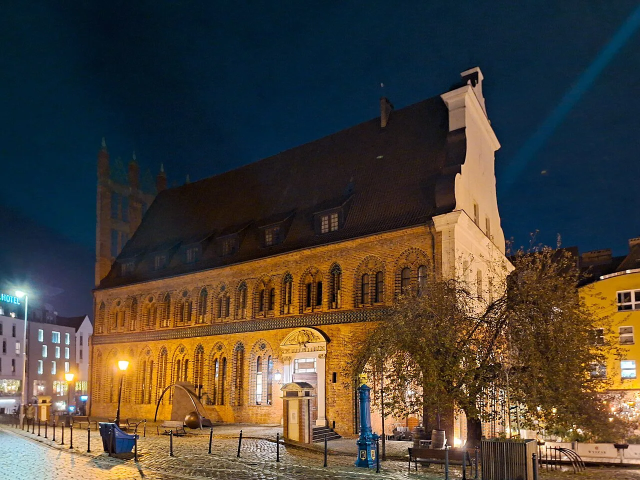Szczecin's Old Town Hall lit up at night.