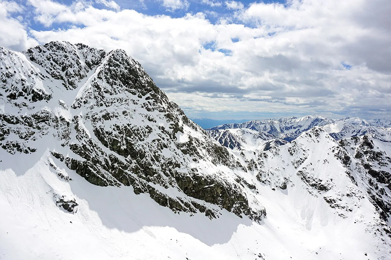 Snow-covered peaks towards Świnica seen from Kościelec in the Tatra National Park.