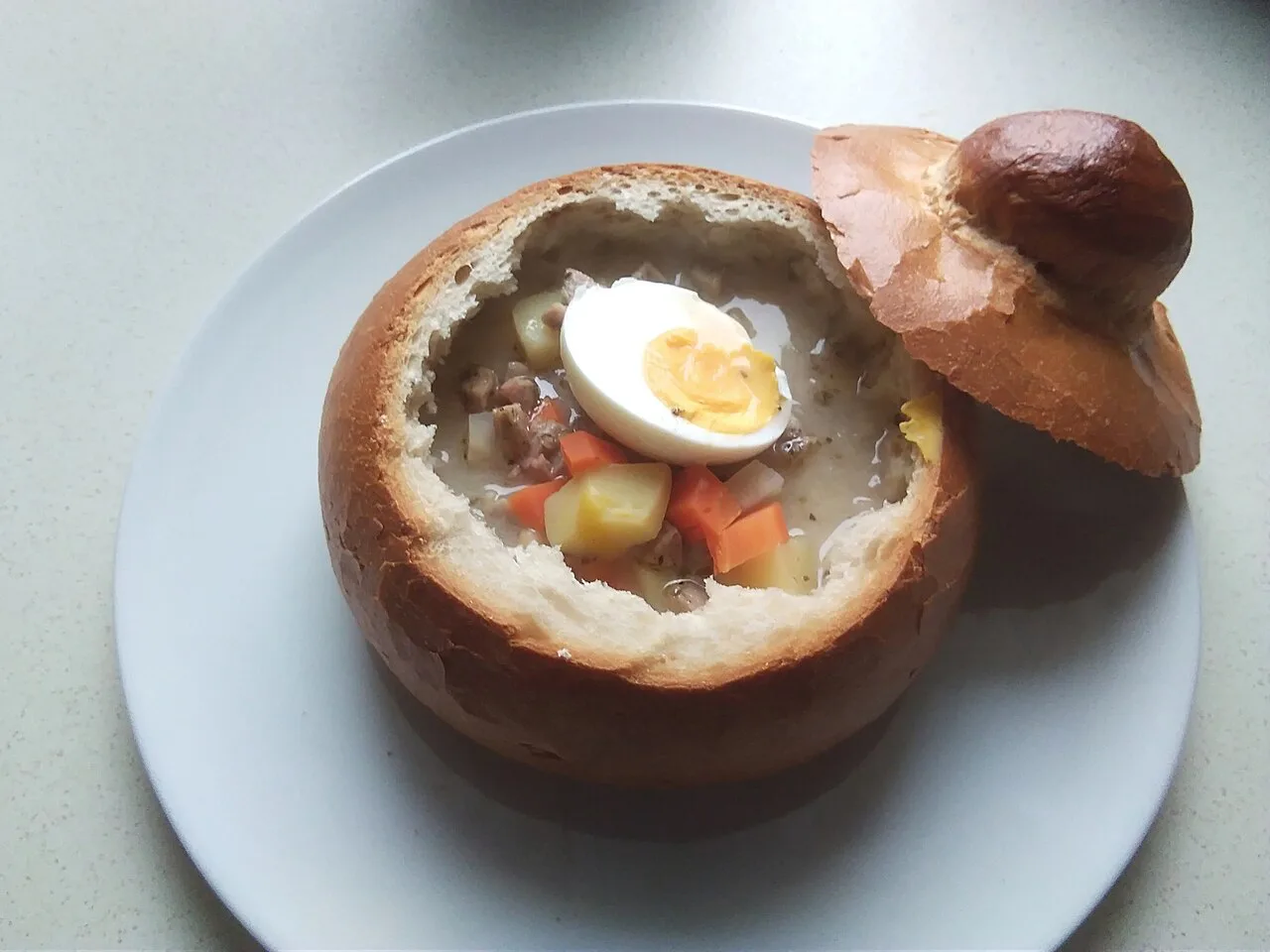 Żurek in a bread bowl in Poznań.