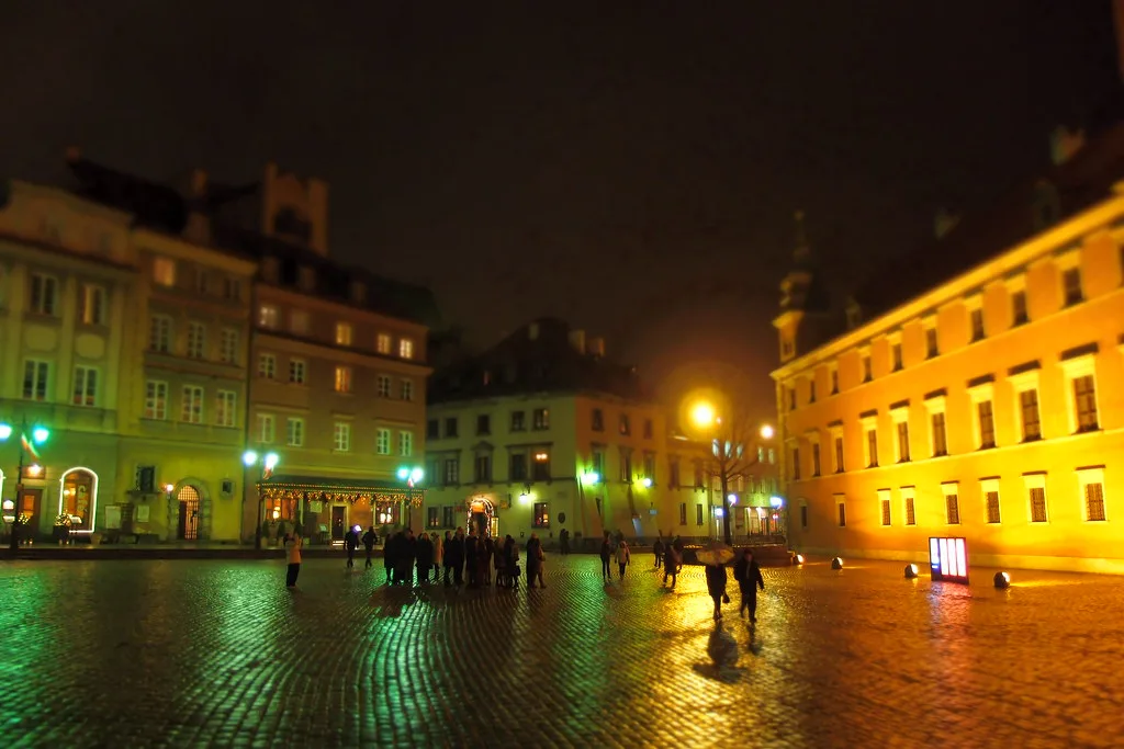 Castle Square in Warsaw on a wet evening.