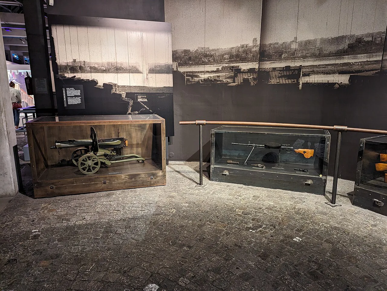 Weapons in display cases in the exhibition at the Warsaw Uprising Museum.