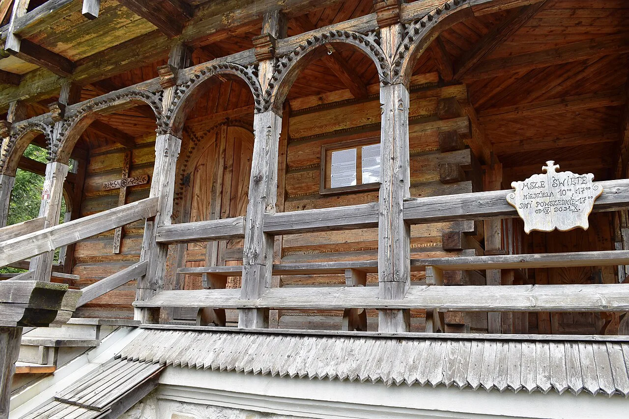 Carved wooden detail of the Jaszczurówka Chapel in Zakopane.