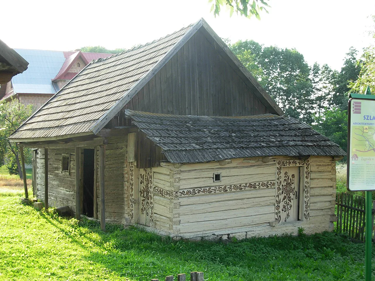 A wooden cottage with painted decoration in Zalipie.